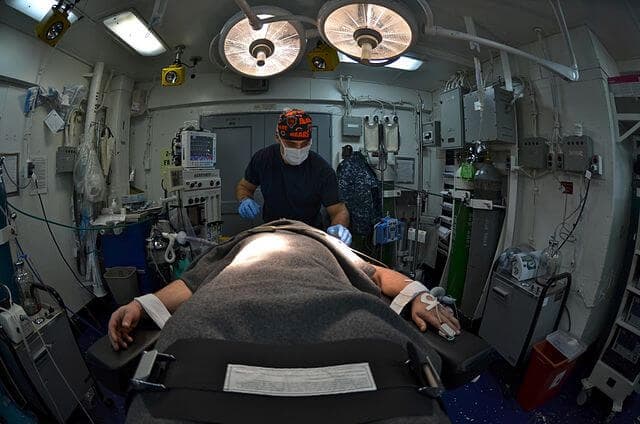 640px Flickr Official U.S. Navy Imagery A Sailor induces general anesthesia on a patient. min